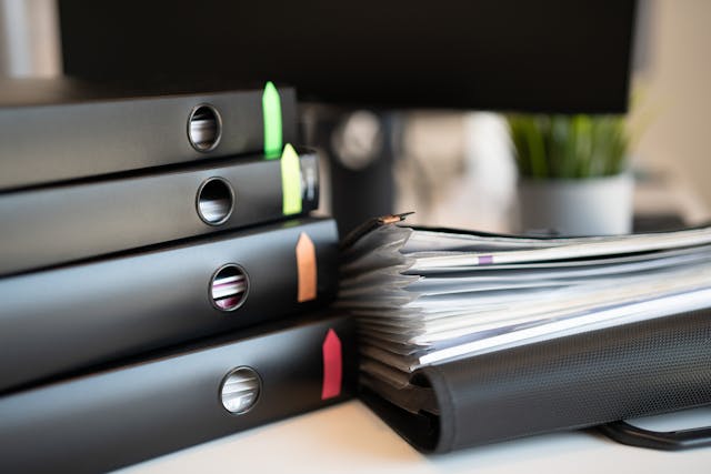a%20bunch%20of%20documents%20and%20files%20in%20black%20folders a%20bunch%20of%20documents%20and%20files%20in%20black%20folders